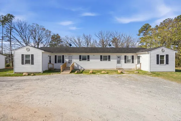 a view of house with backyard and swimming pool