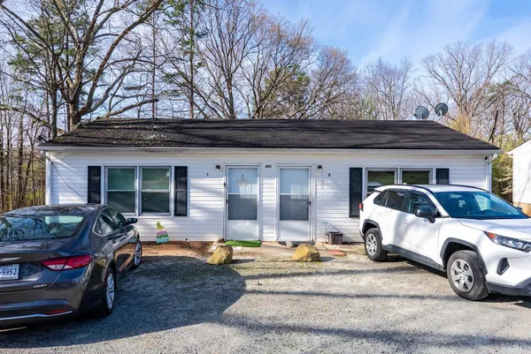 a view of a car parked in front of a house
