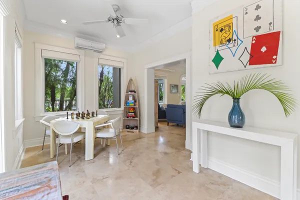 a view of hall way with furniture