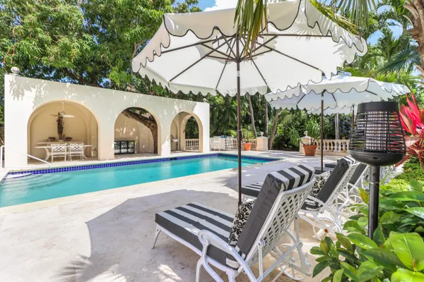 a view of swimming pool with outdoor seating