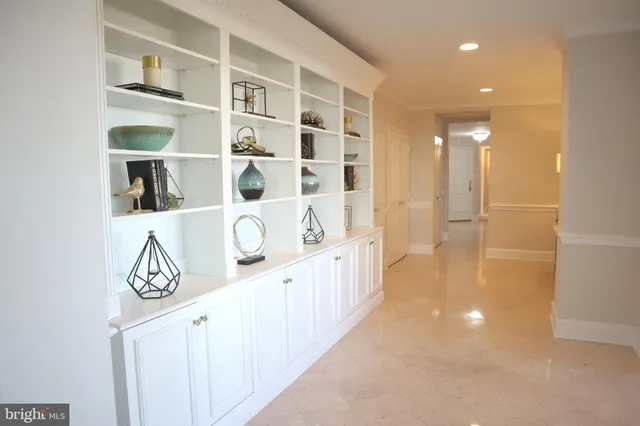 a view of a dining room with furniture a chandelier and wooden floor