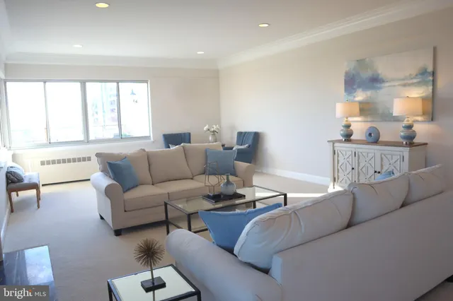 a hallway with windows and cabinet