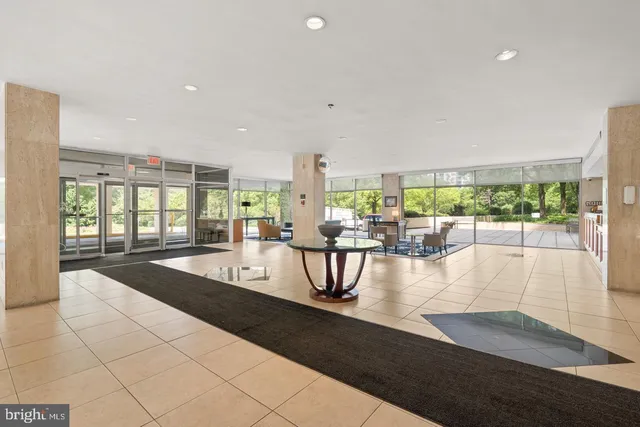 a bathroom with a double vanity sink a tub and a mirror