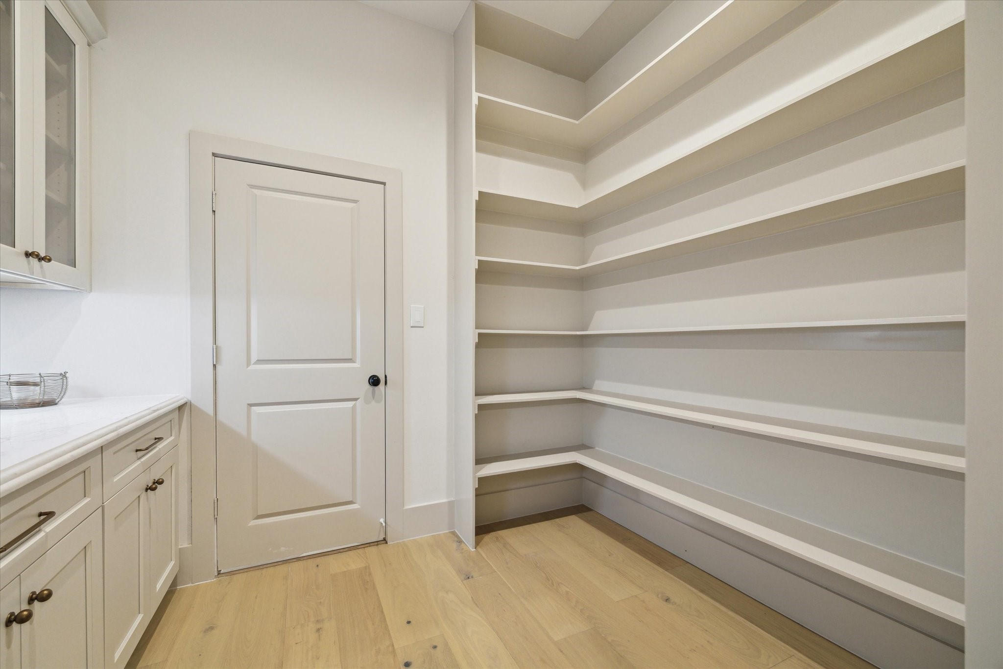 10303 Eddystone Drive Houston, TX 77043 - Photo 12 of 21 a storage room with cabinets