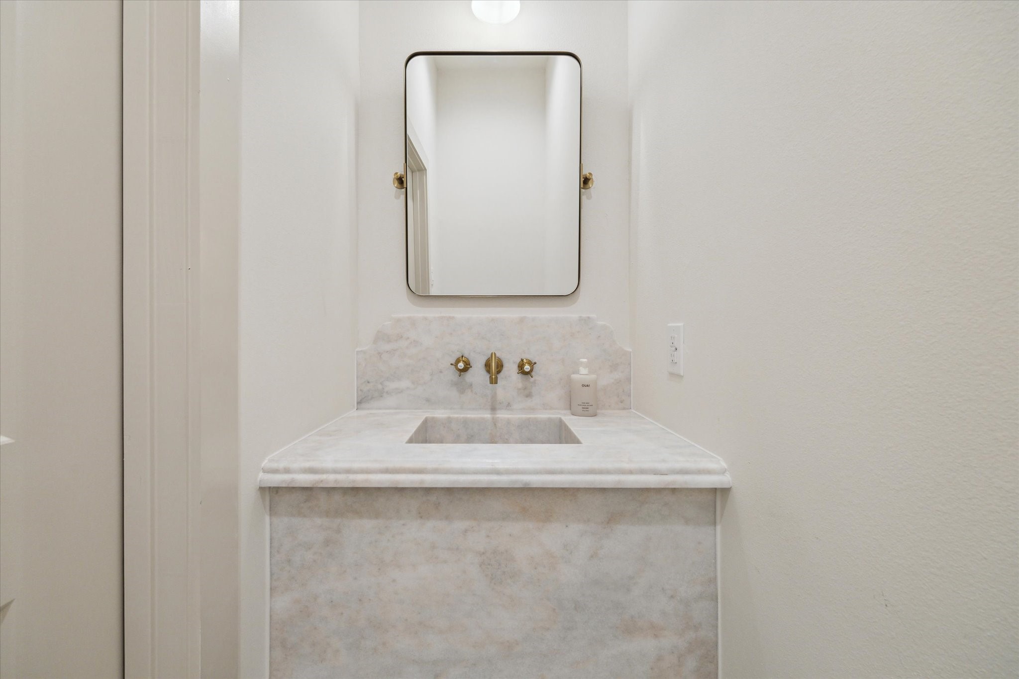 10303 Eddystone Drive Houston, TX 77043 - Photo 14 of 21 a bathroom with a sink and a mirror