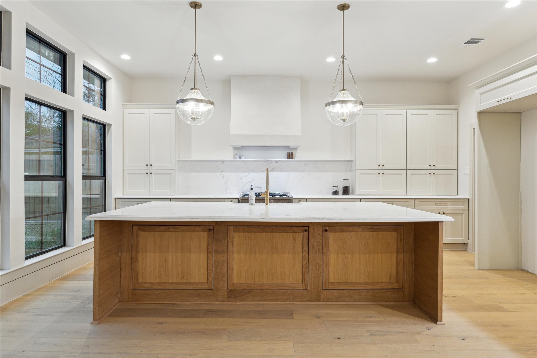 10303 Eddystone Drive Houston, TX 77043 - Photo 6 of 21 a kitchen with a sink cabinets and window