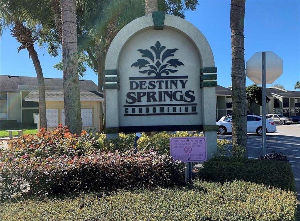 908 Lake Destiny Road, Unit B Altamonte Springs, FL 32714 - Photo 1 of 16 a sign that is sitting in front of flowers