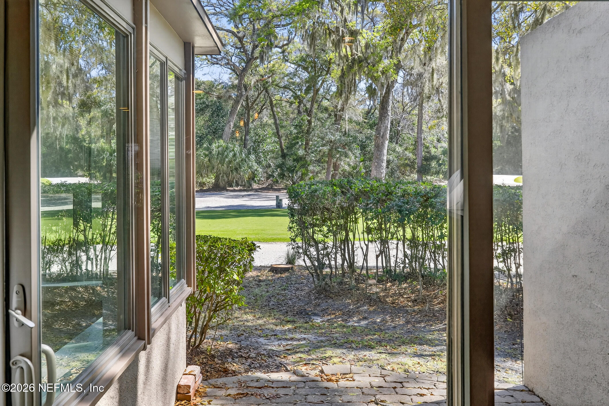 3301 Sea Marsh Road Fernandina Beach, FL 32034 - Photo 9 of 41 a view of a porch with chairs and backyard
