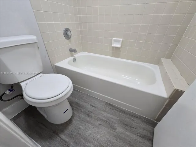 a bathroom with a toilet and a sink