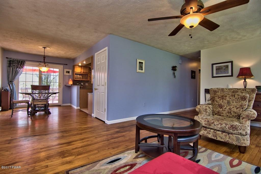 1058 Rosengrant Road Lake Ariel, PA 18436 - Photo 4 of 47 a living room with furniture and a chandelier