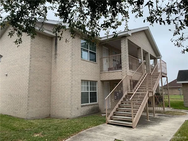 front view of a house with a small yard