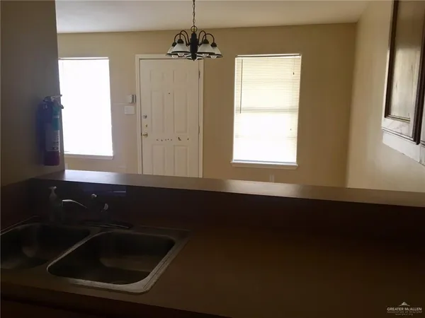 a kitchen that has a sink and a window