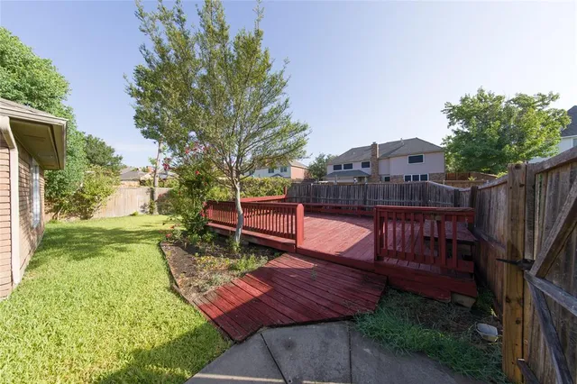 a view of a backyard with sitting area