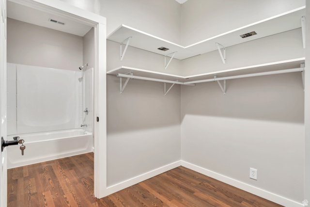 2154 Wasatch Boulevard Sandy, UT 84092 - Photo 53 of 55 Spacious closet featuring dark wood-style flooring