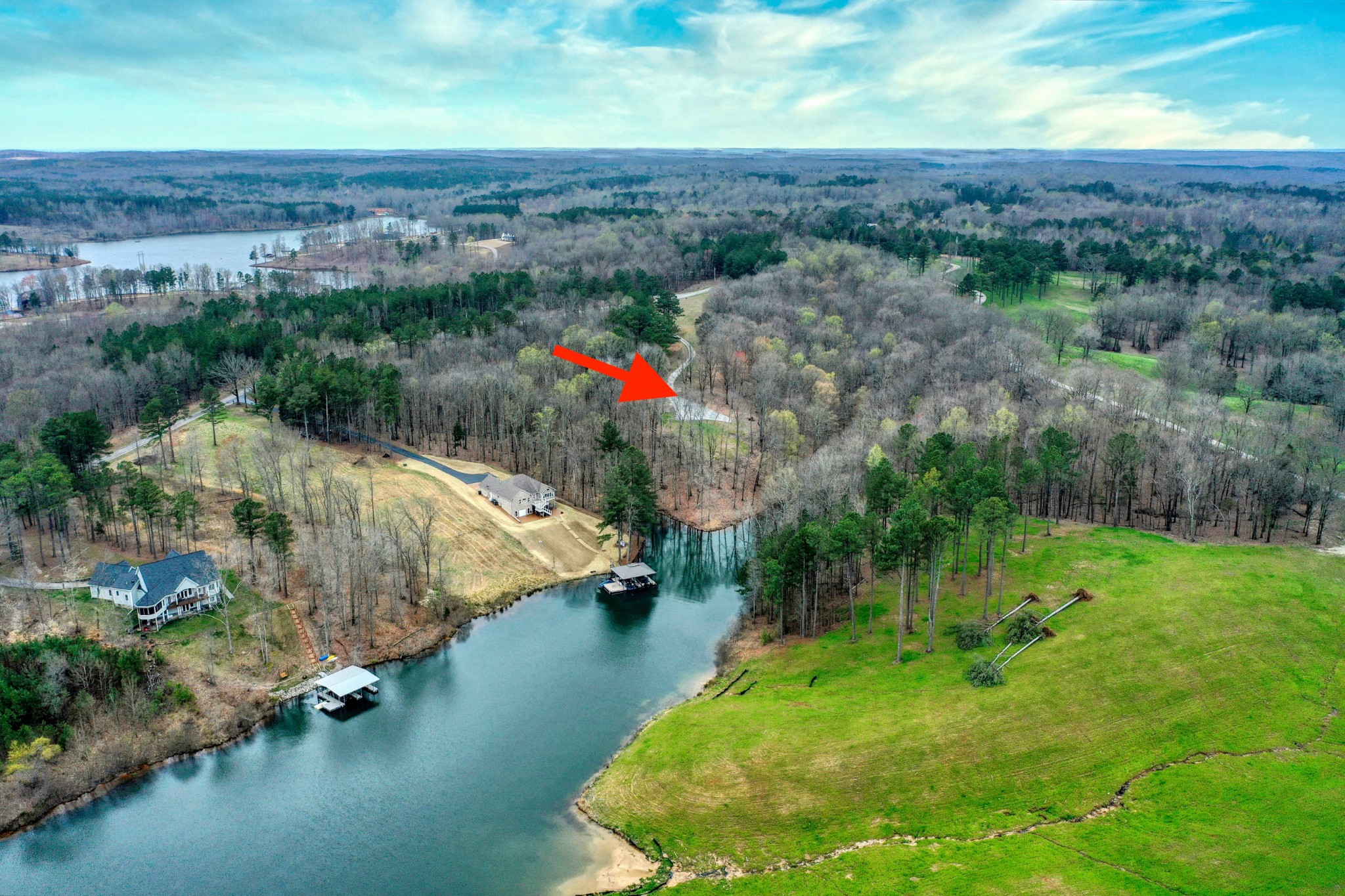 1570 Reedy Creek Road Huntingdon, TN 38344 - Photo 2 of 9 an aerial view of a houses with outdoor space and lake view