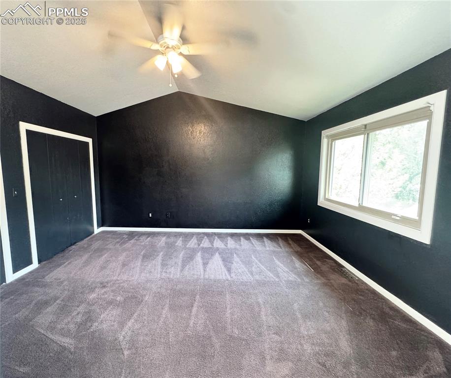 5117 Solar Ridge Drive Colorado Springs, CO 80917 - Photo 14 of 28 a view of an empty room with window and chandelier fan