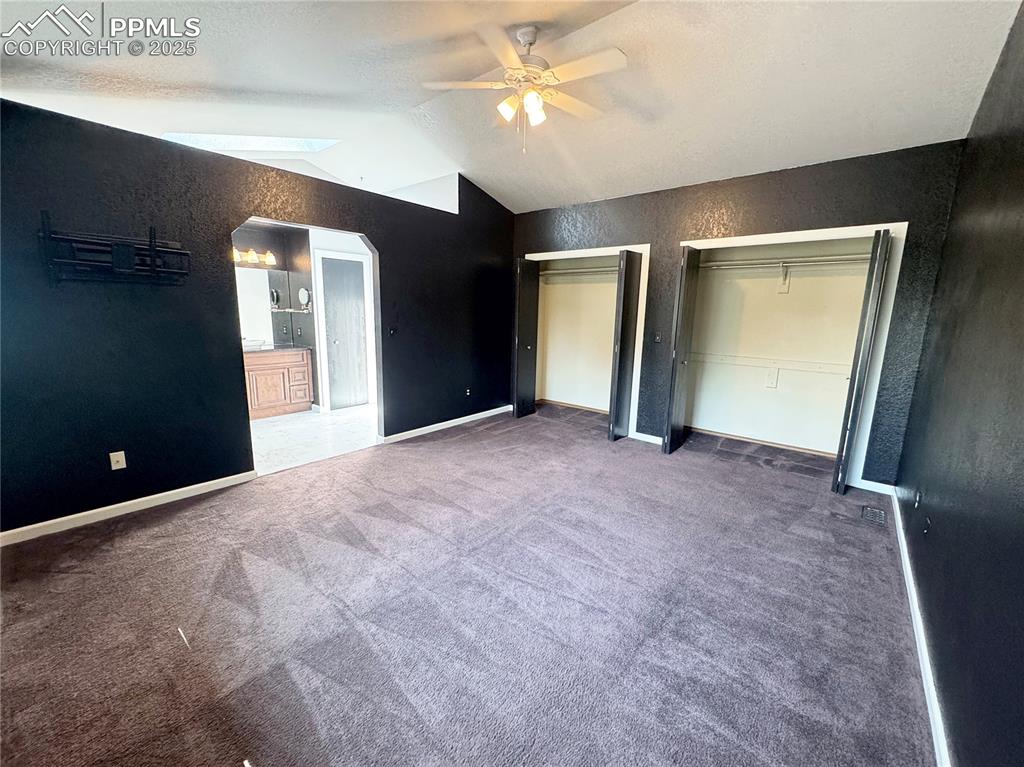5117 Solar Ridge Drive Colorado Springs, CO 80917 - Photo 16 of 28 an empty room with closet and a chandelier fan