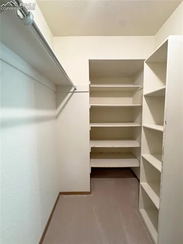 a view of an empty walk in closet