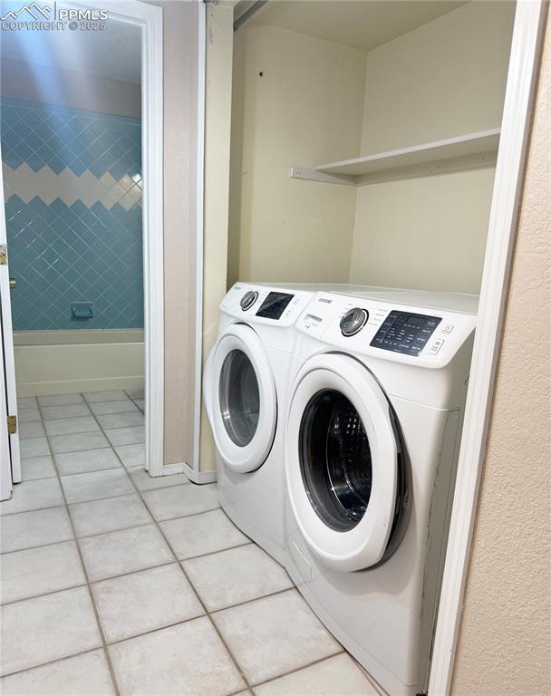 5117 Solar Ridge Drive Colorado Springs, CO 80917 - Photo 21 of 28 a utility room with dryer and washer