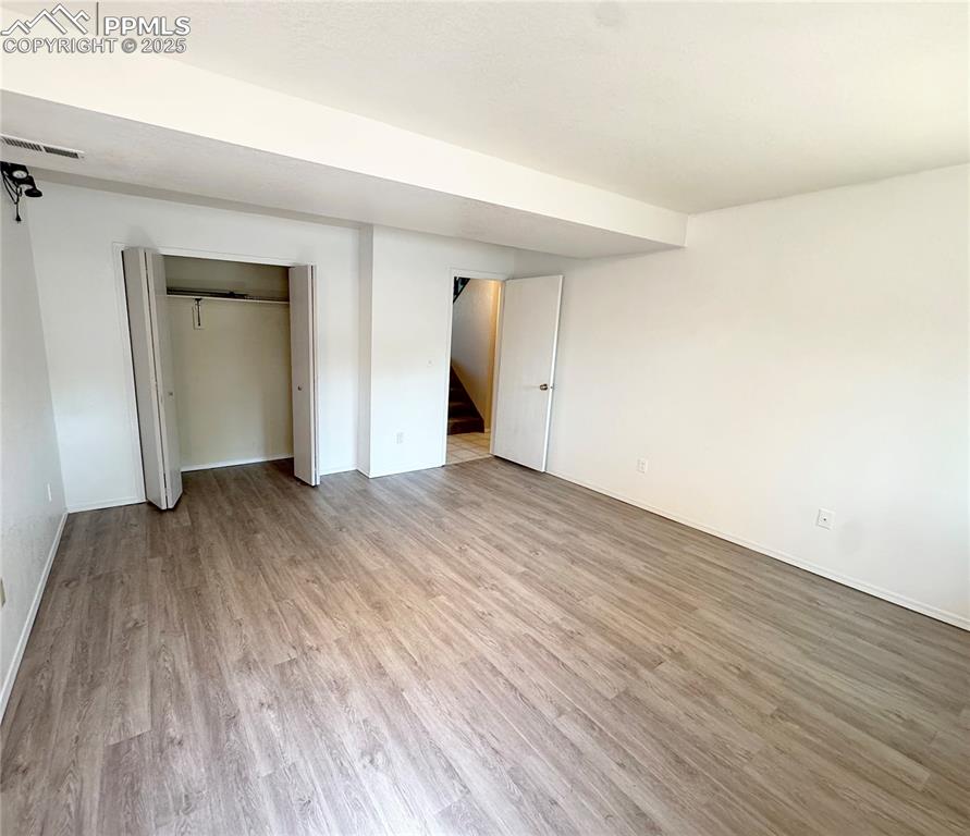 5117 Solar Ridge Drive Colorado Springs, CO 80917 - Photo 24 of 28 a view of empty room with wooden floor