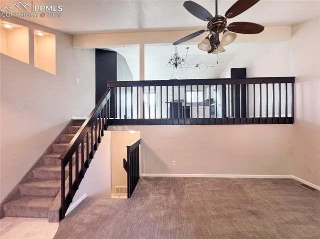 a view of a hallway with staircase