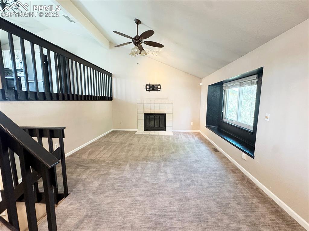 5117 Solar Ridge Drive Colorado Springs, CO 80917 - Photo 4 of 28 a view of a livingroom with a ceiling fan and windows