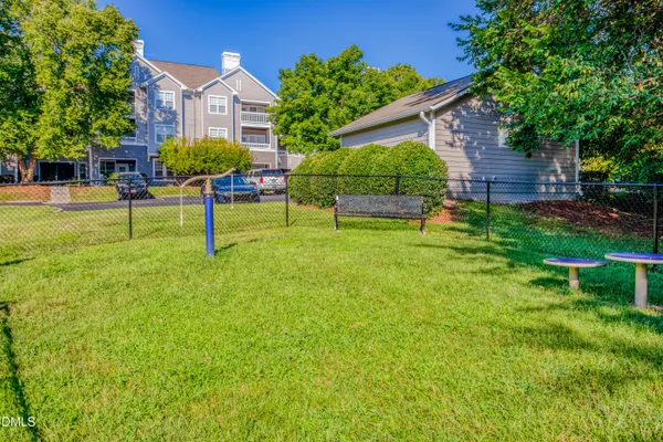 a view of house with a backyard