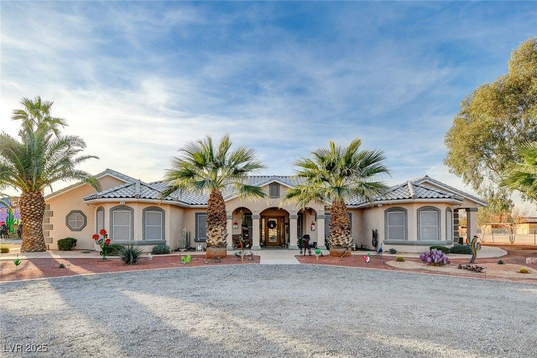 2125 Mateuse Street Logandale, NV 89021 - Photo 1 of 62 Mediterranean / spanish-style home with stucco siding and a tiled roof