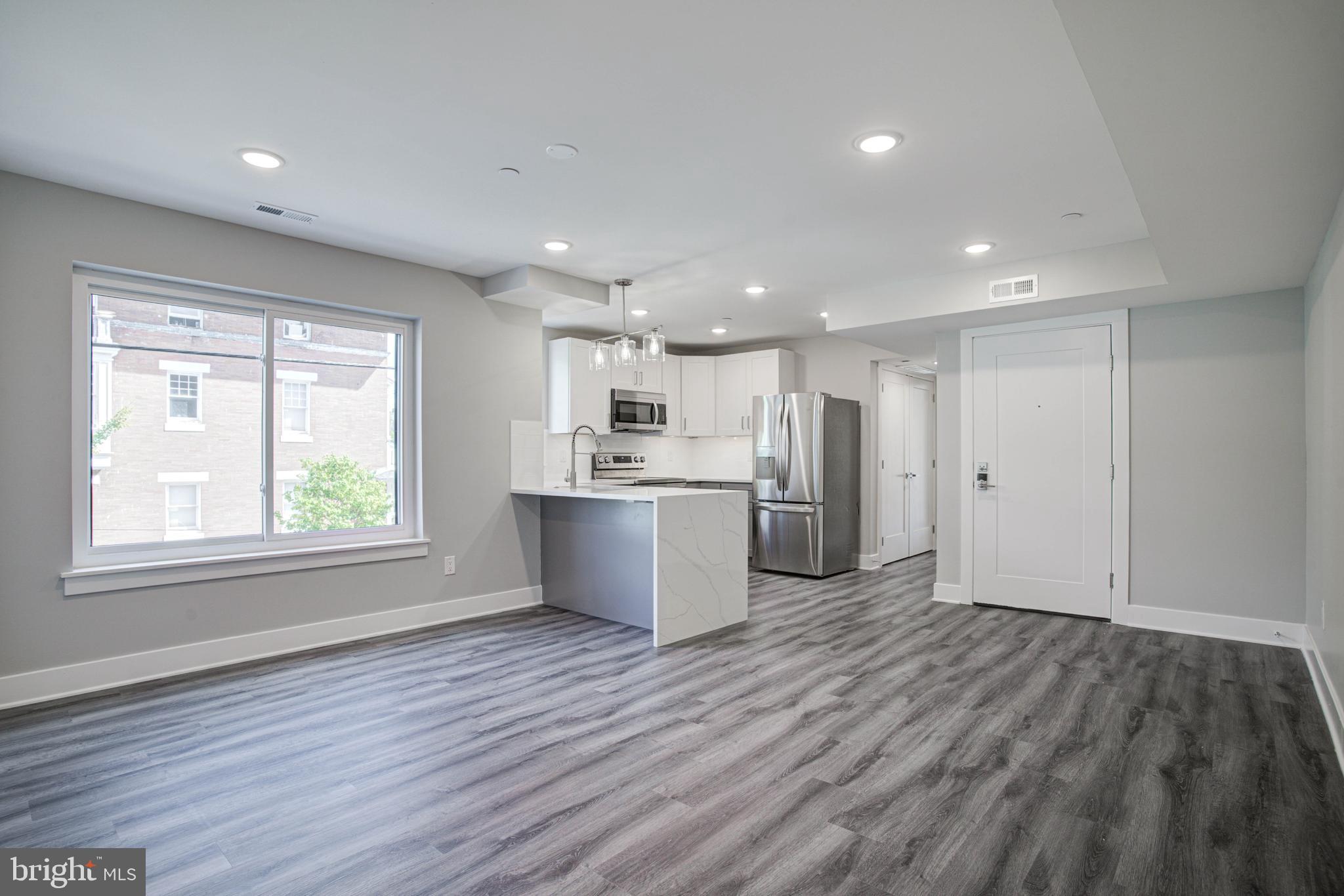 540 South 52nd Street, Unit 4 Philadelphia, PA 19143 - Photo 1 of 22 a view of kitchen with wooden floor and window
