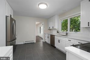 16 Cherry Brook Drive Princeton, NJ 08540 - Photo 11 of 28 a kitchen with stainless steel appliances a sink stove and refrigerator
