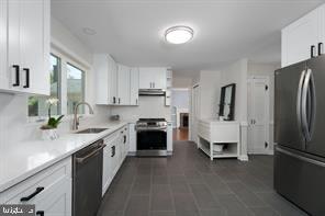 16 Cherry Brook Drive Princeton, NJ 08540 - Photo 12 of 28 a kitchen with stainless steel appliances a stove a sink and a refrigerator