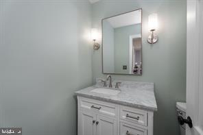 16 Cherry Brook Drive Princeton, NJ 08540 - Photo 14 of 28 a bathroom with a granite countertop sink and a mirror