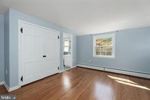 16 Cherry Brook Drive Princeton, NJ 08540 - Photo 21 of 28 an empty room with wooden floor and windows