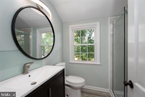 16 Cherry Brook Drive Princeton, NJ 08540 - Photo 25 of 28 a bathroom with a sink a toilet and a mirror