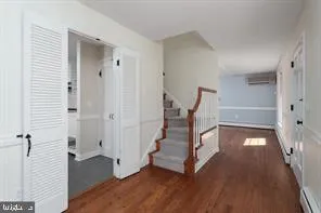 a view of entryway with wooden floor