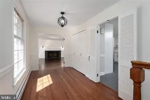 a view of a livingroom with an empty space and a window