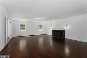 16 Cherry Brook Drive Princeton, NJ 08540 - Photo 6 of 28 an empty room with wooden floor fireplace and windows