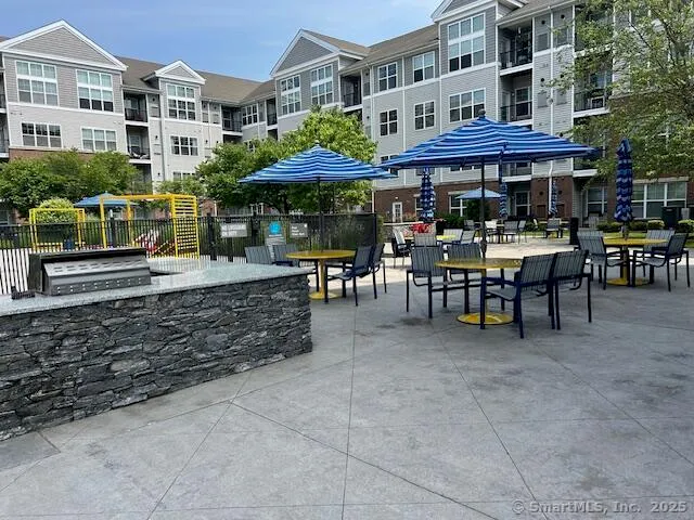 a view of a cafe with sitting area