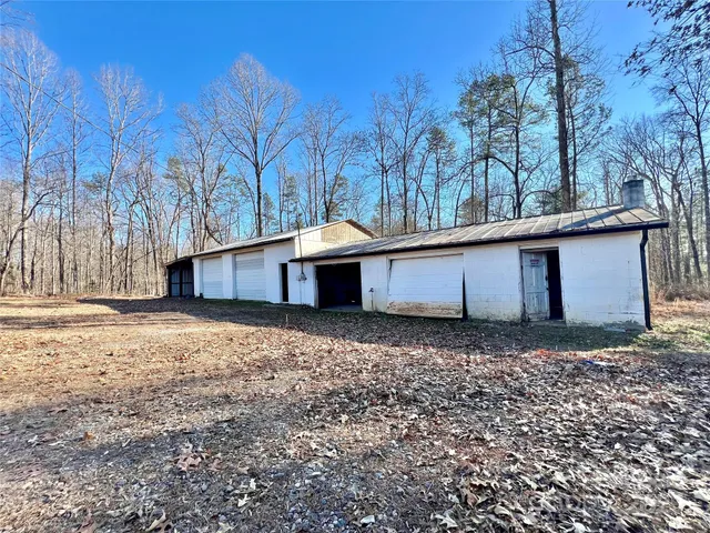 a view of a house with a snow on the road