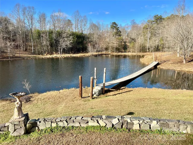 a view of swimming pool and mountain in the back