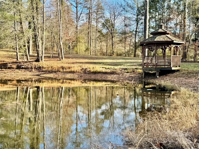 a view of a yard with swimming pool