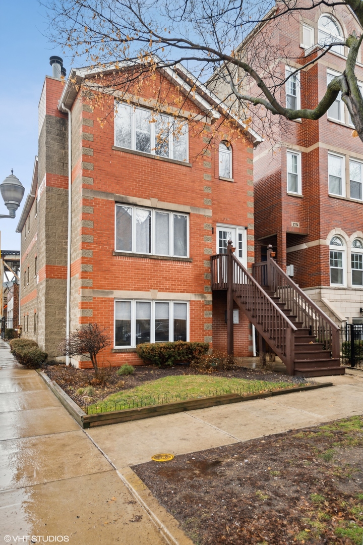 1756 West Roscoe Street Chicago, IL 60657 - Photo 1 of 19 front view of a house with a street