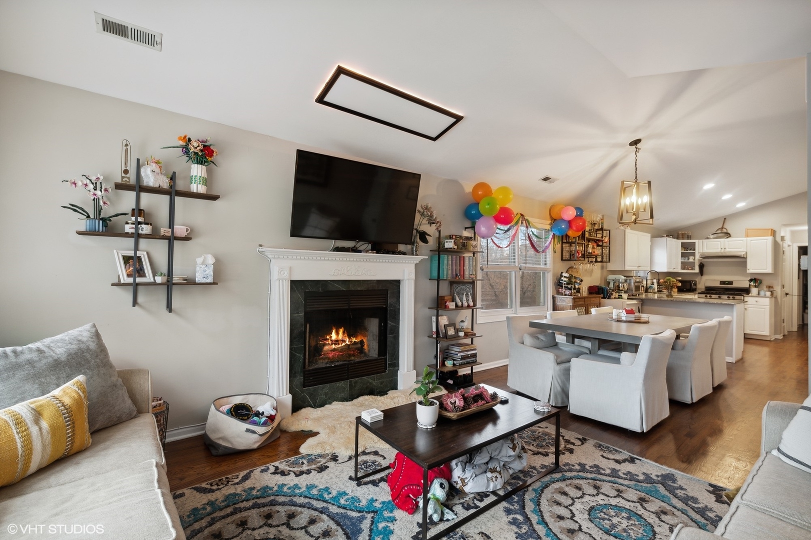 1756 West Roscoe Street Chicago, IL 60657 - Photo 11 of 19 a living room with furniture fireplace and flat screen tv