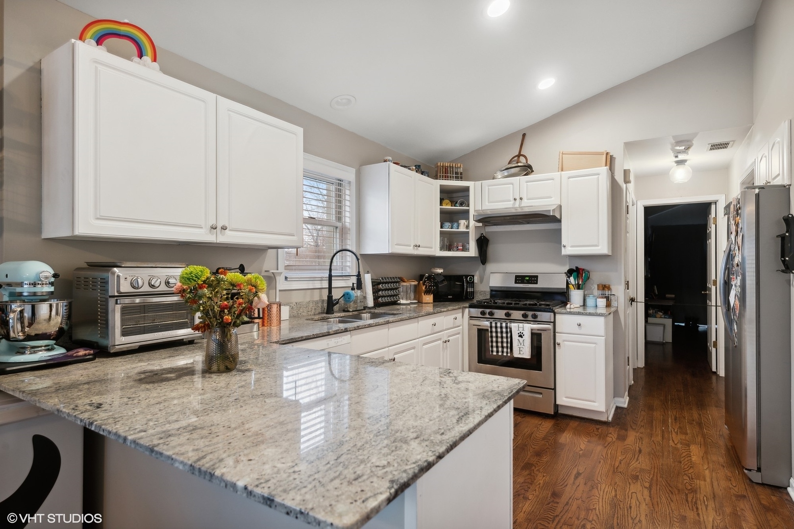 1756 West Roscoe Street Chicago, IL 60657 - Photo 14 of 19 a kitchen with refrigerator and stove