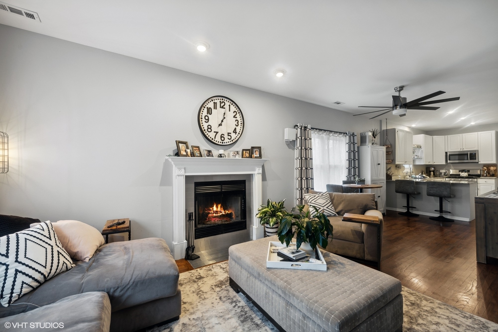 1756 West Roscoe Street Chicago, IL 60657 - Photo 2 of 19 a living room with furniture and a fireplace