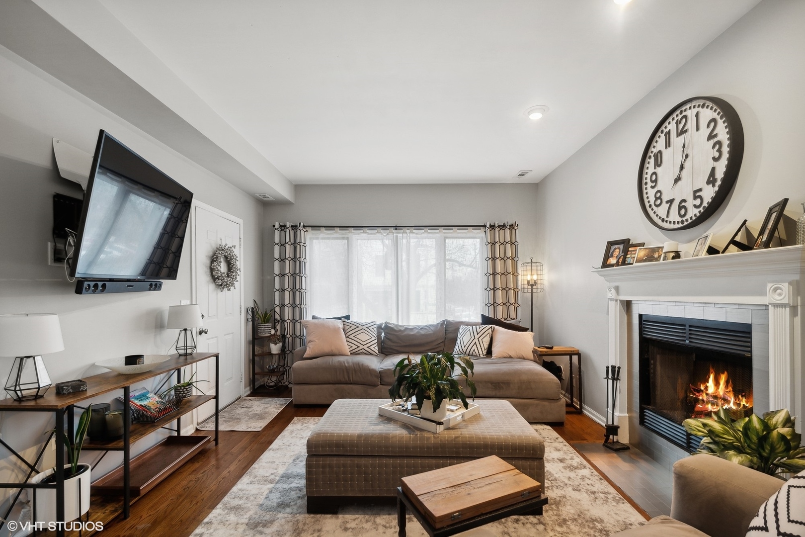 1756 West Roscoe Street Chicago, IL 60657 - Photo 3 of 19 a living room with furniture a window and a fireplace