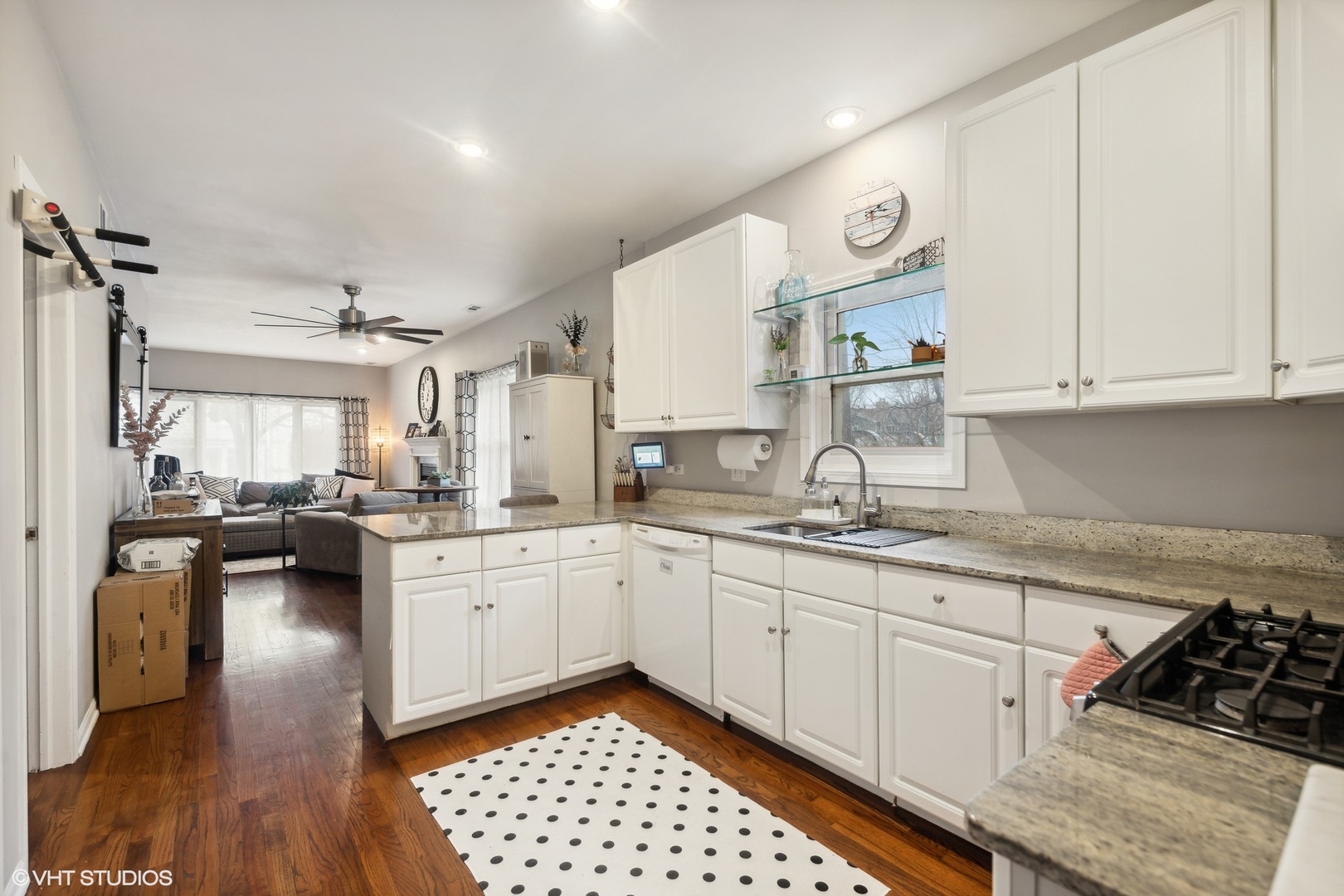 1756 West Roscoe Street Chicago, IL 60657 - Photo 6 of 19 a kitchen with a white cabinets and white appliances