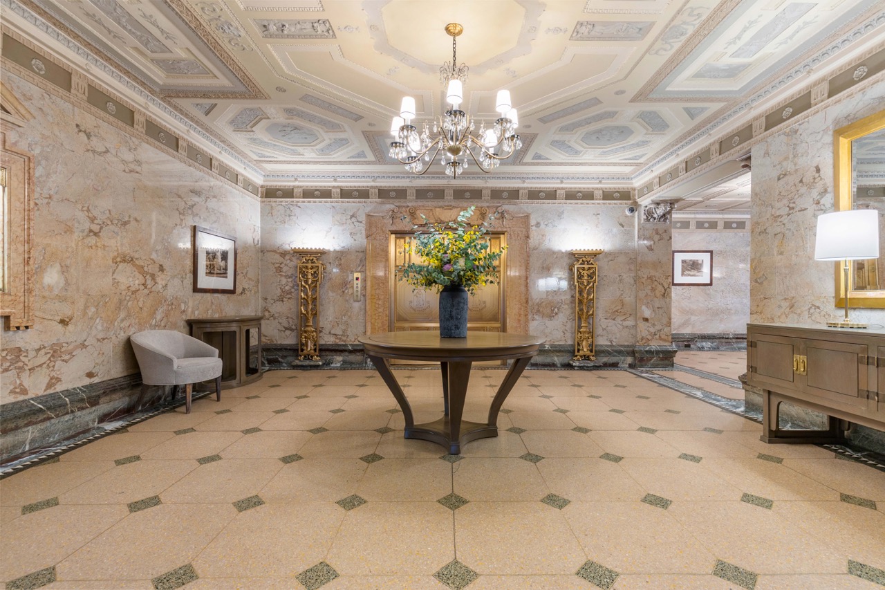 211 Central Park West, Unit 8E Manhattan, NY 10024 - Photo 11 of 14 a view of a dining room with furniture and a chandelier