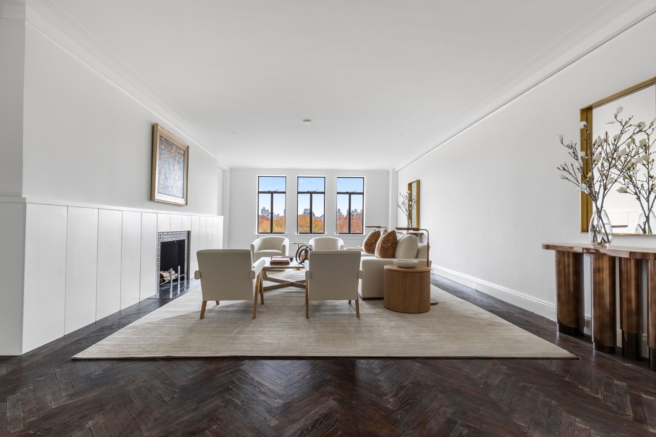 211 Central Park West, Unit 8E Manhattan, NY 10024 - Photo 2 of 14 a living room with furniture wooden floor and a fireplace