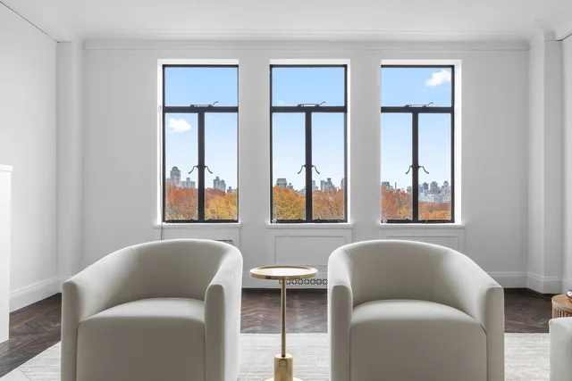 a living room with furniture and windows